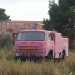 Un curioso camioncino rosso alle spalle del distributore di benzina di via Buozzi